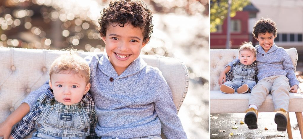 big brother holds baby during family portraits with St. Louis family photographer Hollyberry Studio