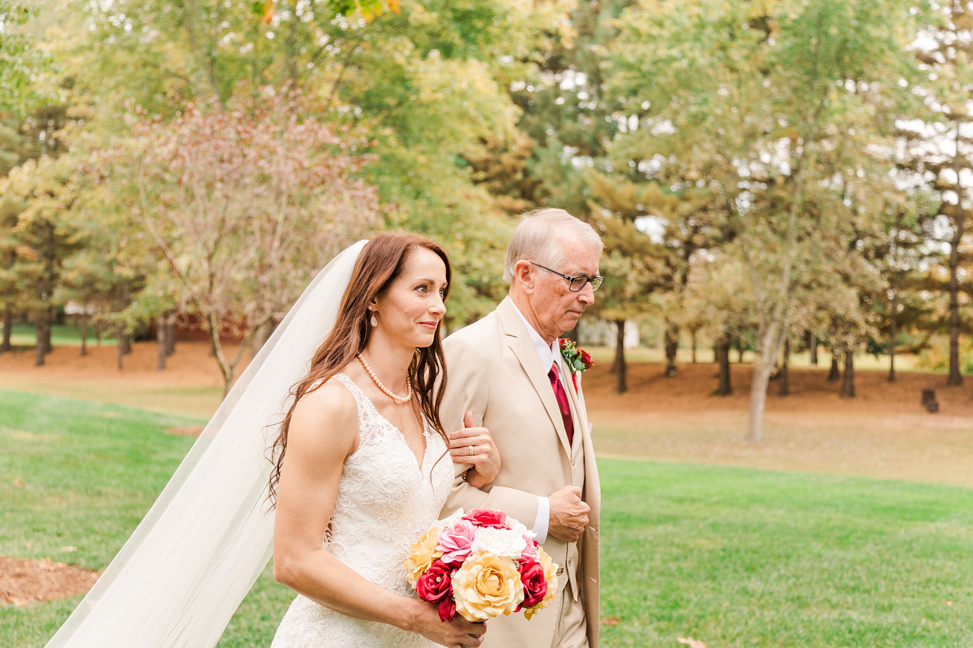 father walks bride down the aisle during backyard wedding in Godfrey IL