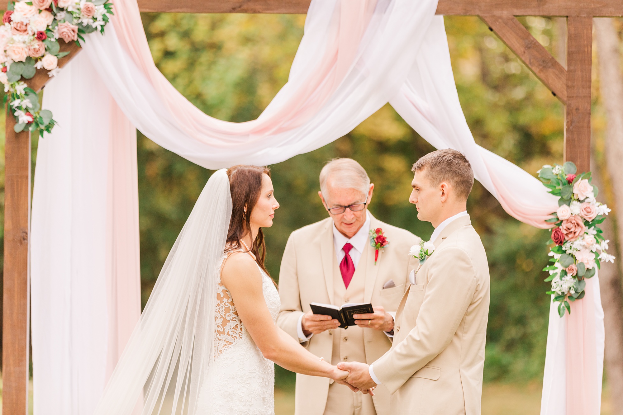 newlyweds exchange vows during backyard wedding in Godfrey IL