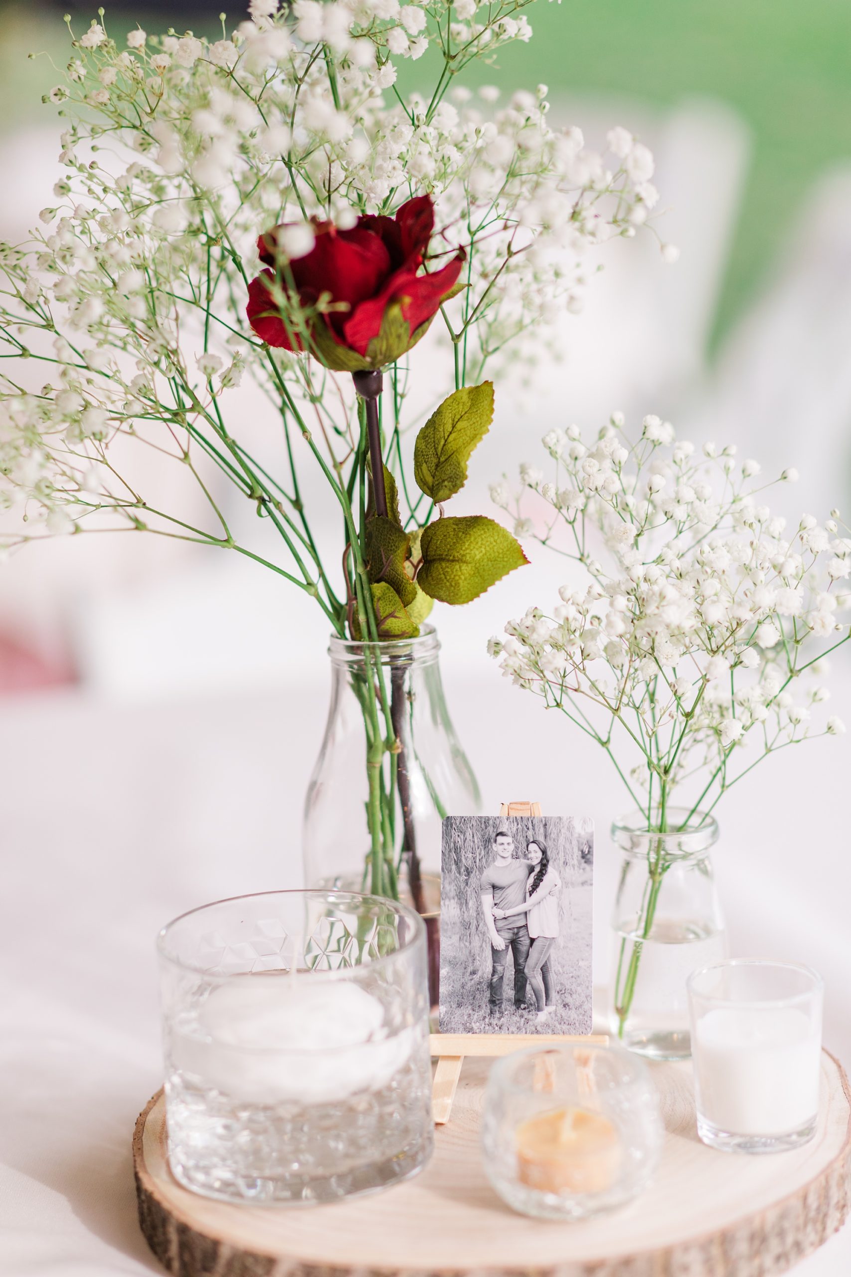 simple centerpieces with red rose and baby's breath