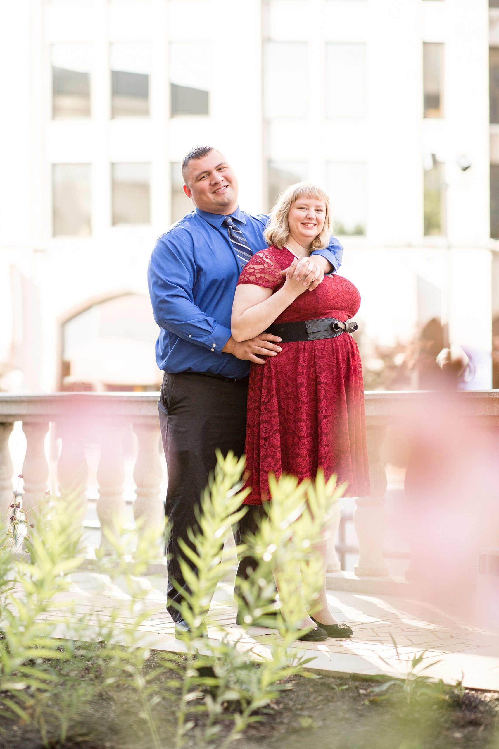 engaged couple poses in library garden in St. Louis MO