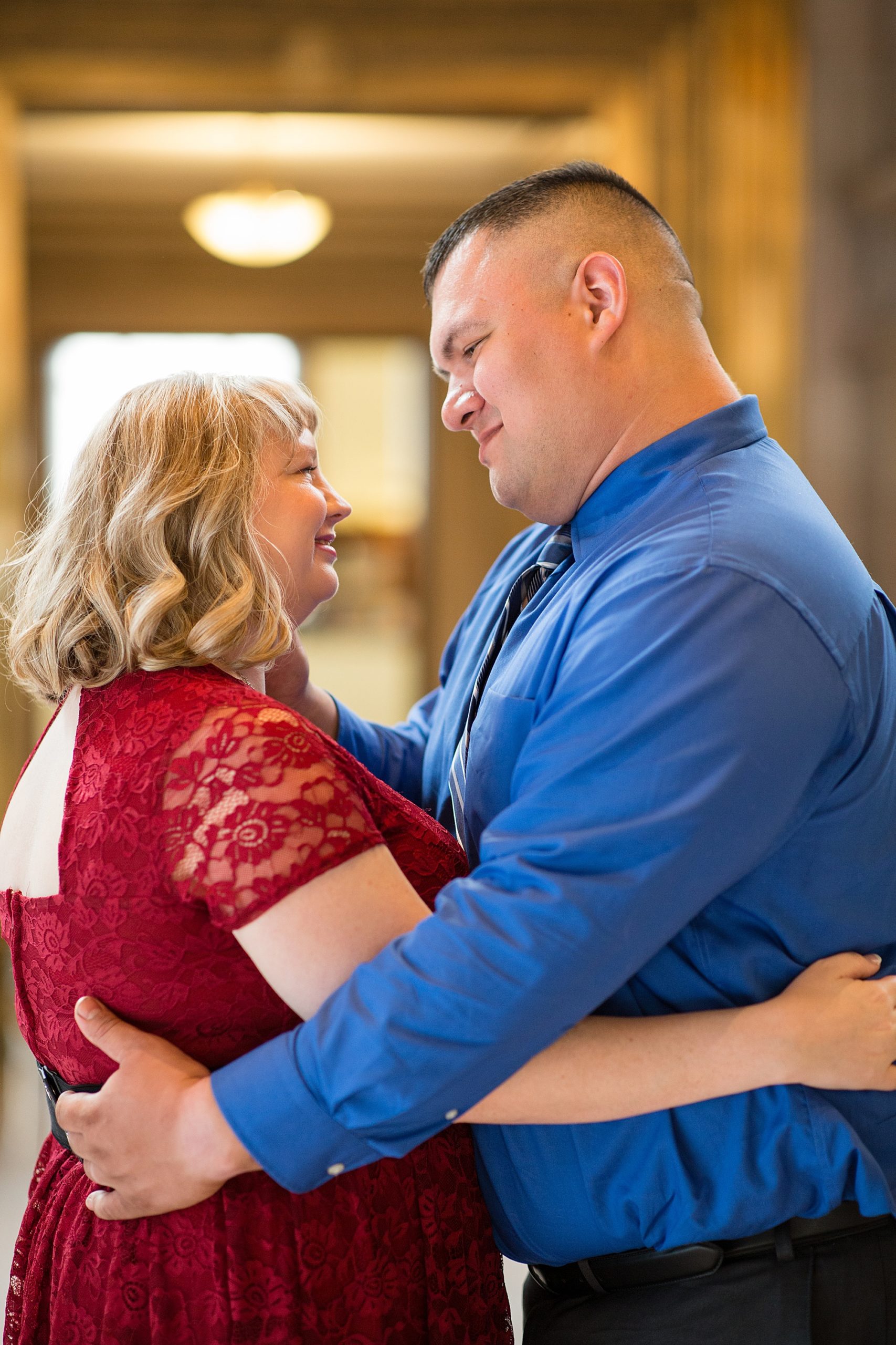 engaged couple hugs during Central Library engagement session