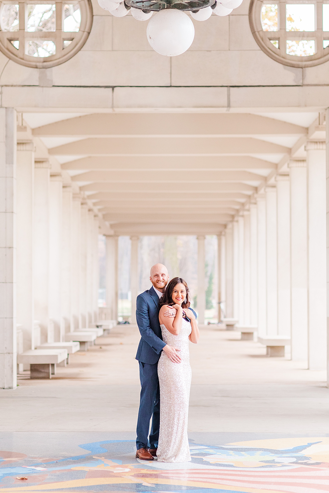 couple hugs in hallway during Forest Park engagement session