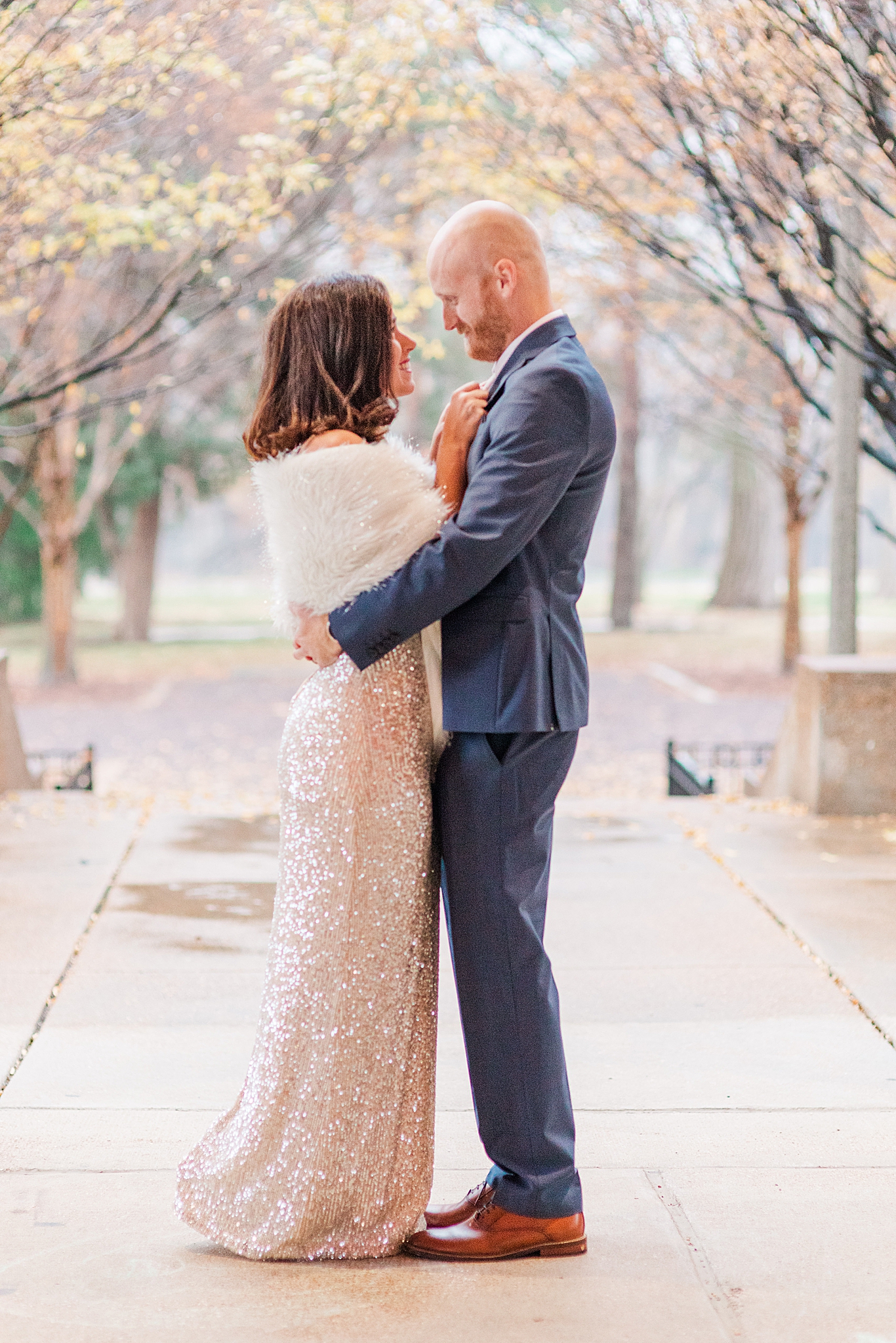 bride and groom hug during winter engagement session
