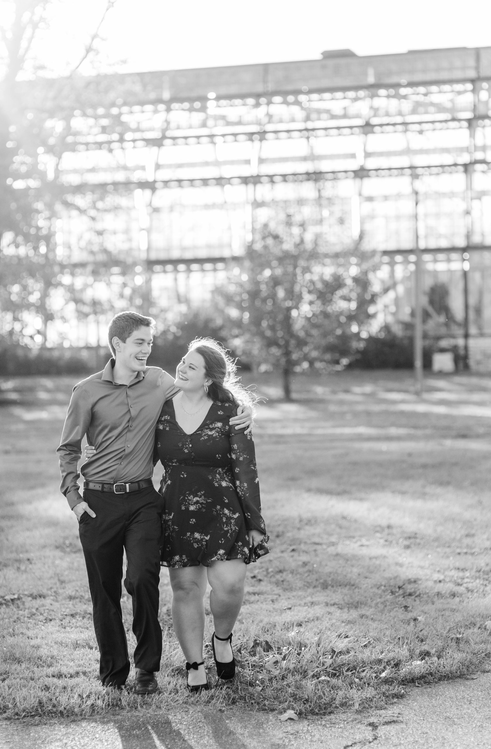 engaged couple walks through gardens in St. Louis