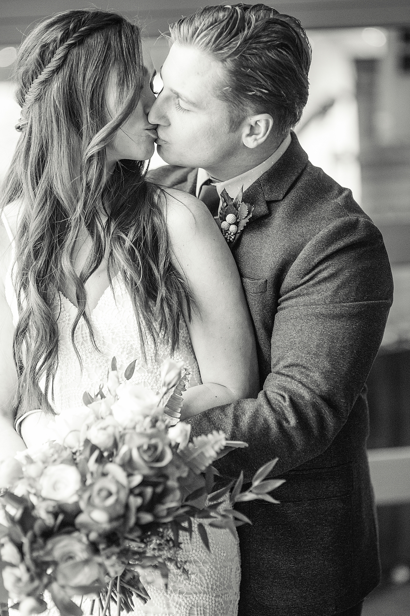 newlyweds kiss during wedding portraits at Haue Valley
