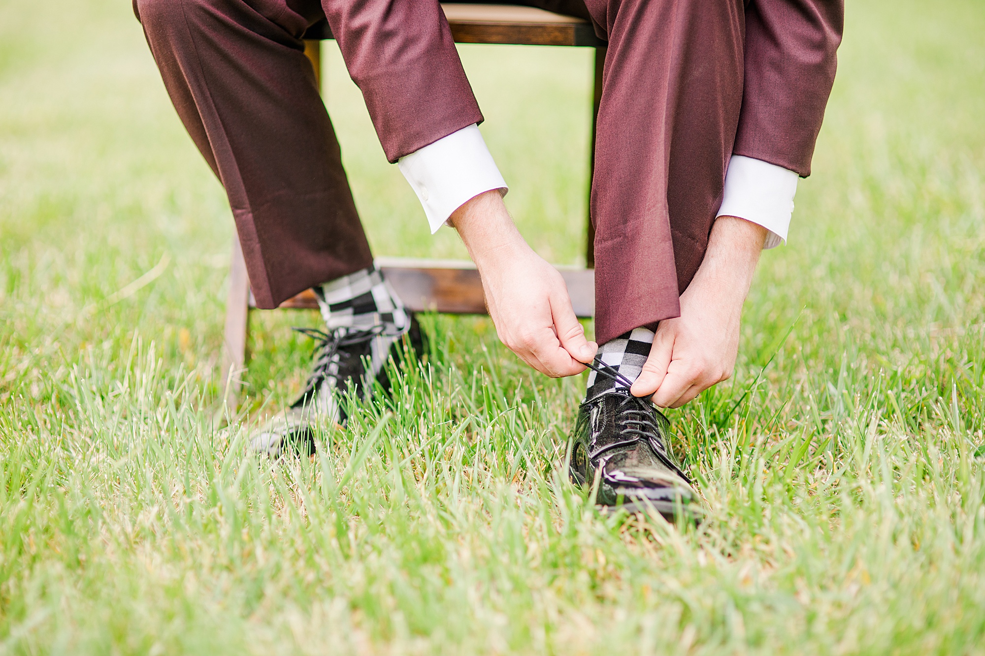 bride adjusts shoes before Pierce Century Farm wedding
