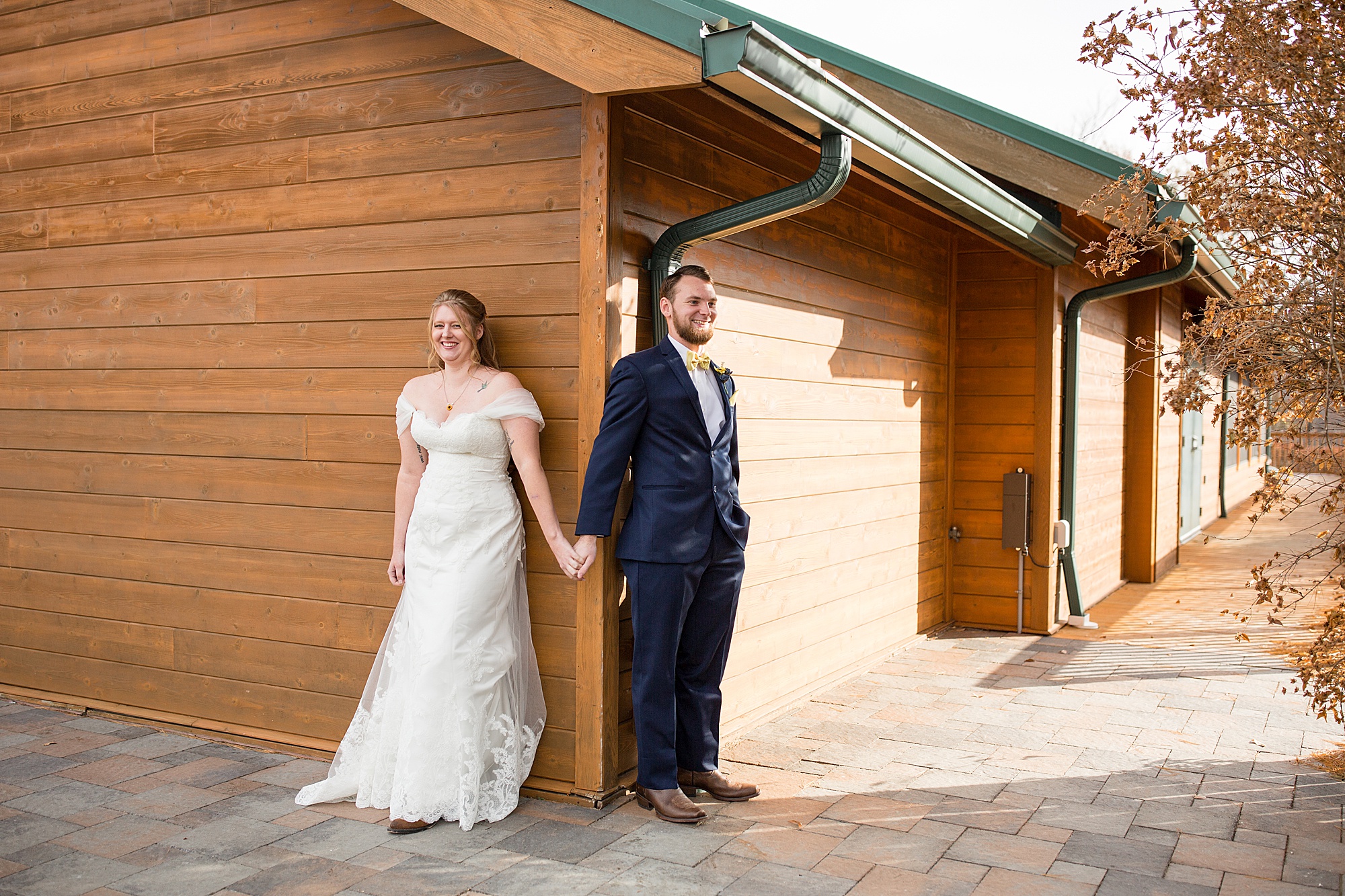 bride and groom have first touch at Quail Ridge Lodge