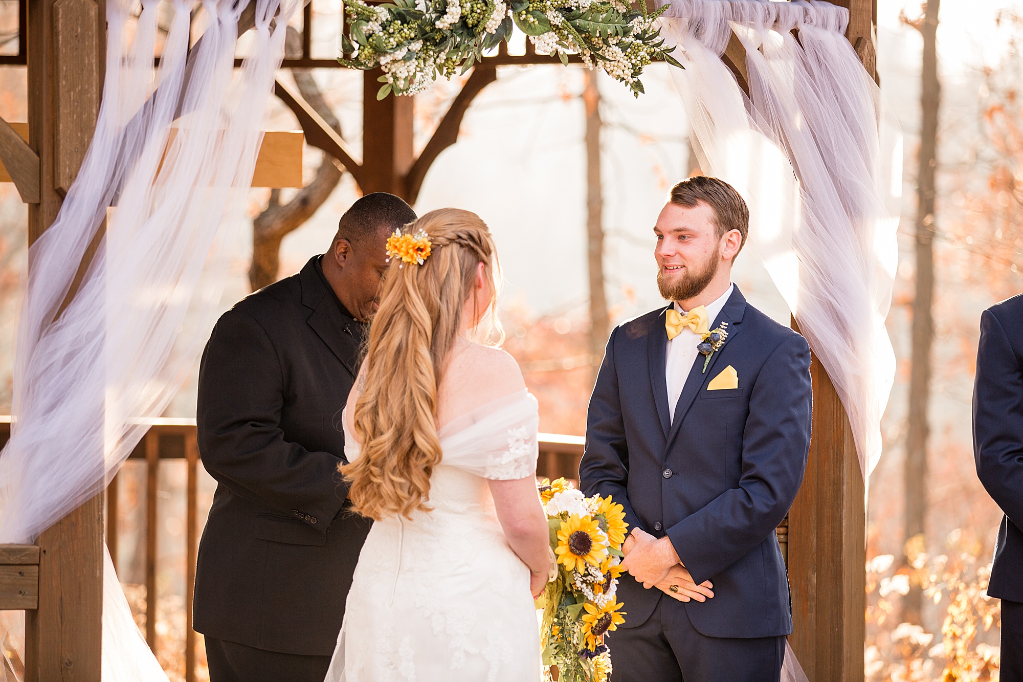 bride and groom exchange vows during wedding ceremony in Wentzville MO