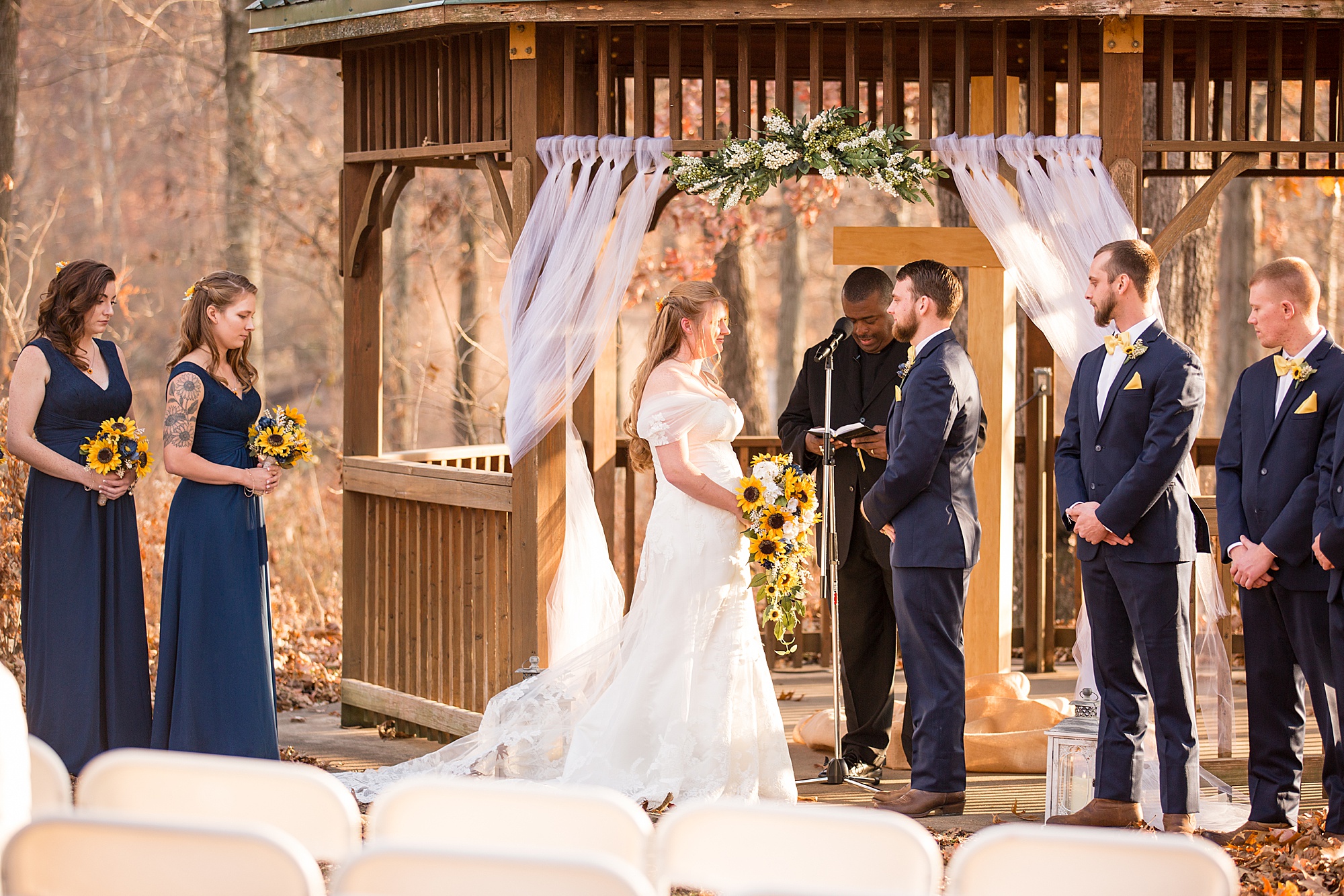 bride and groom exchange vows during wedding ceremony in Wentzville MO
