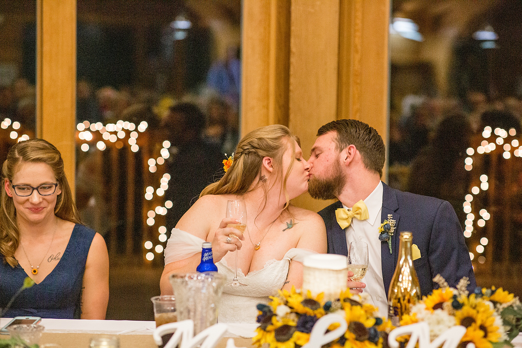 bride and groom kiss at MO wedding reception