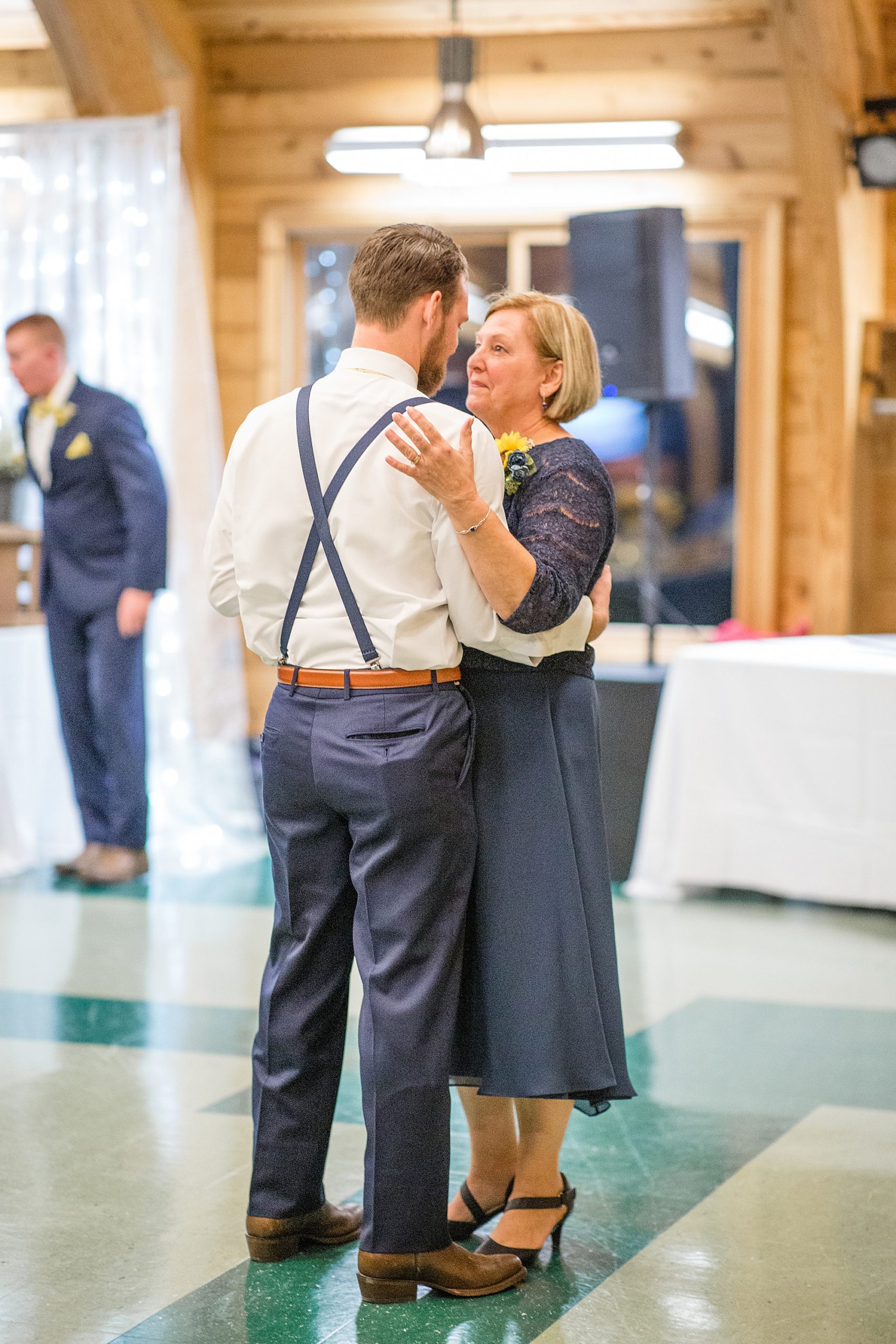 mom and groom dance at MO wedding reception