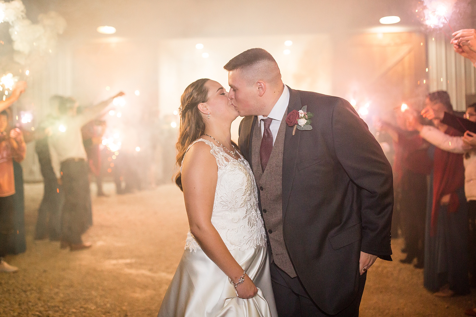 newlyweds kiss during wedding ceremony exit