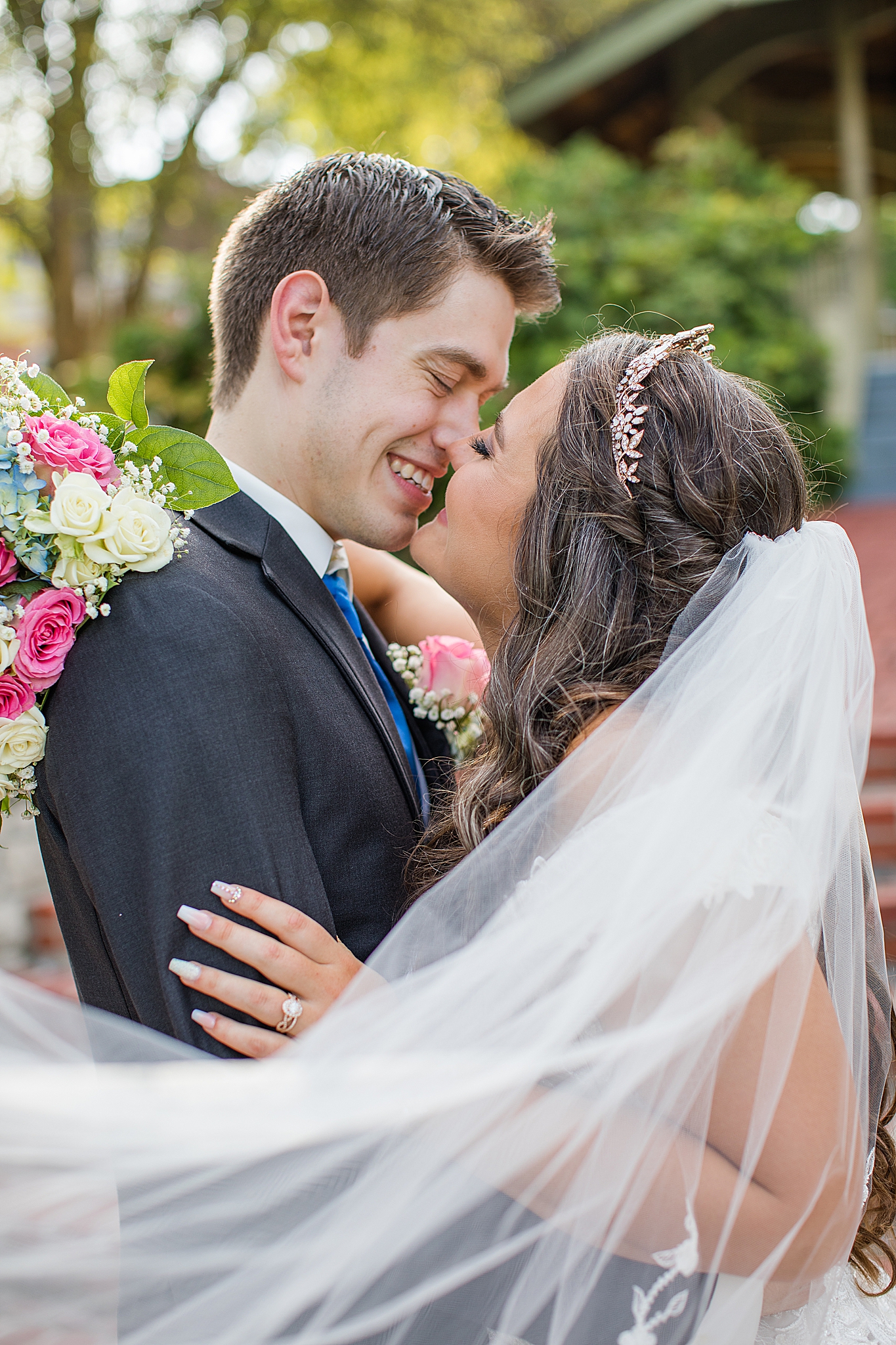 bride and groom kiss during portraits at Old Hickory Golf Club