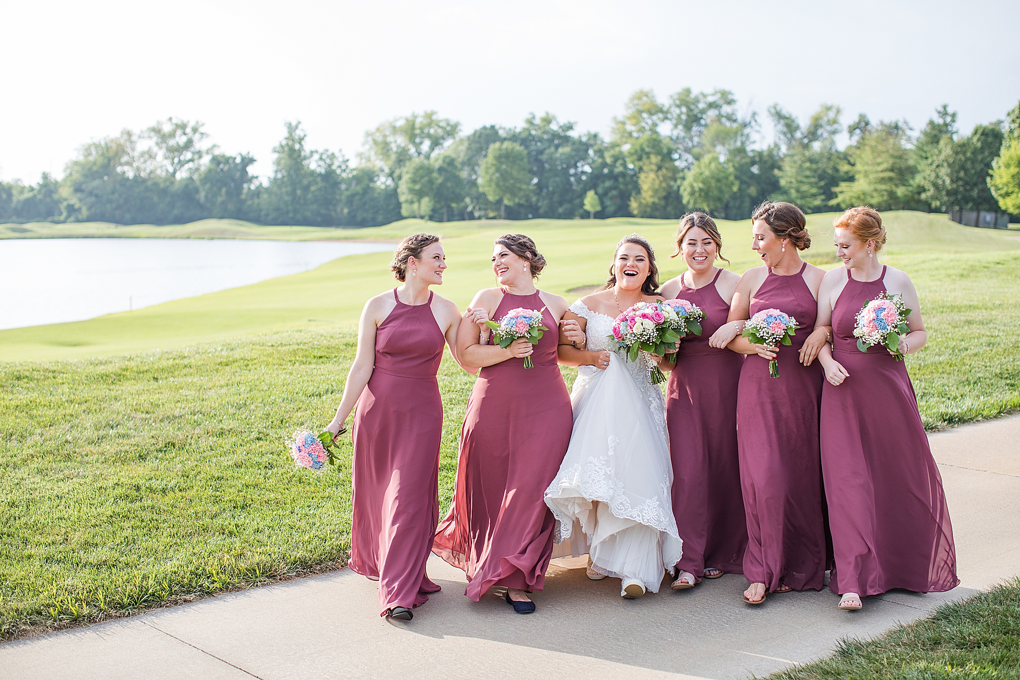 bride walks with bridesmaids at Old Hickory Golf Club