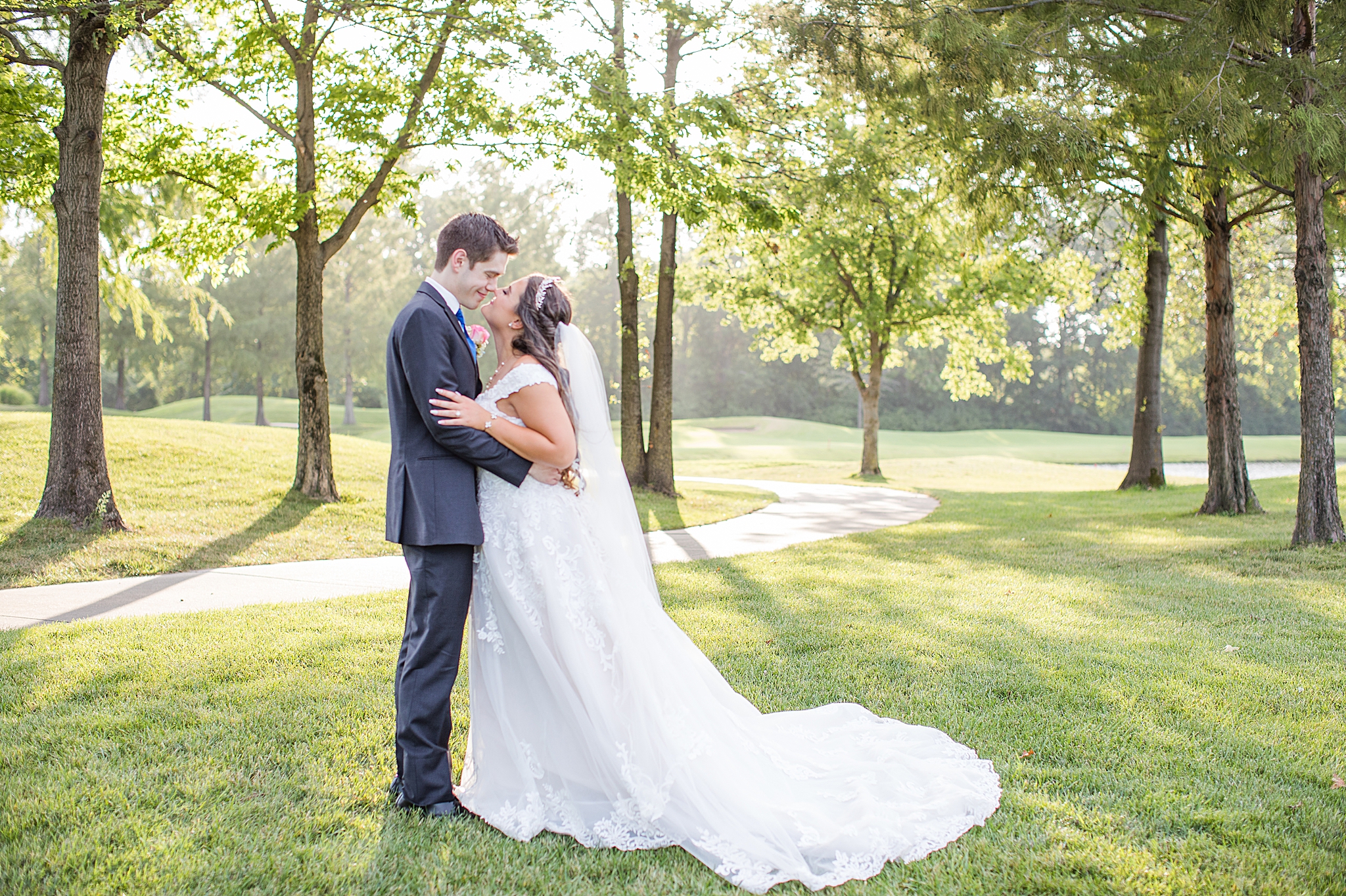 bride and groom pose in woods of Old Hickory Golf Club