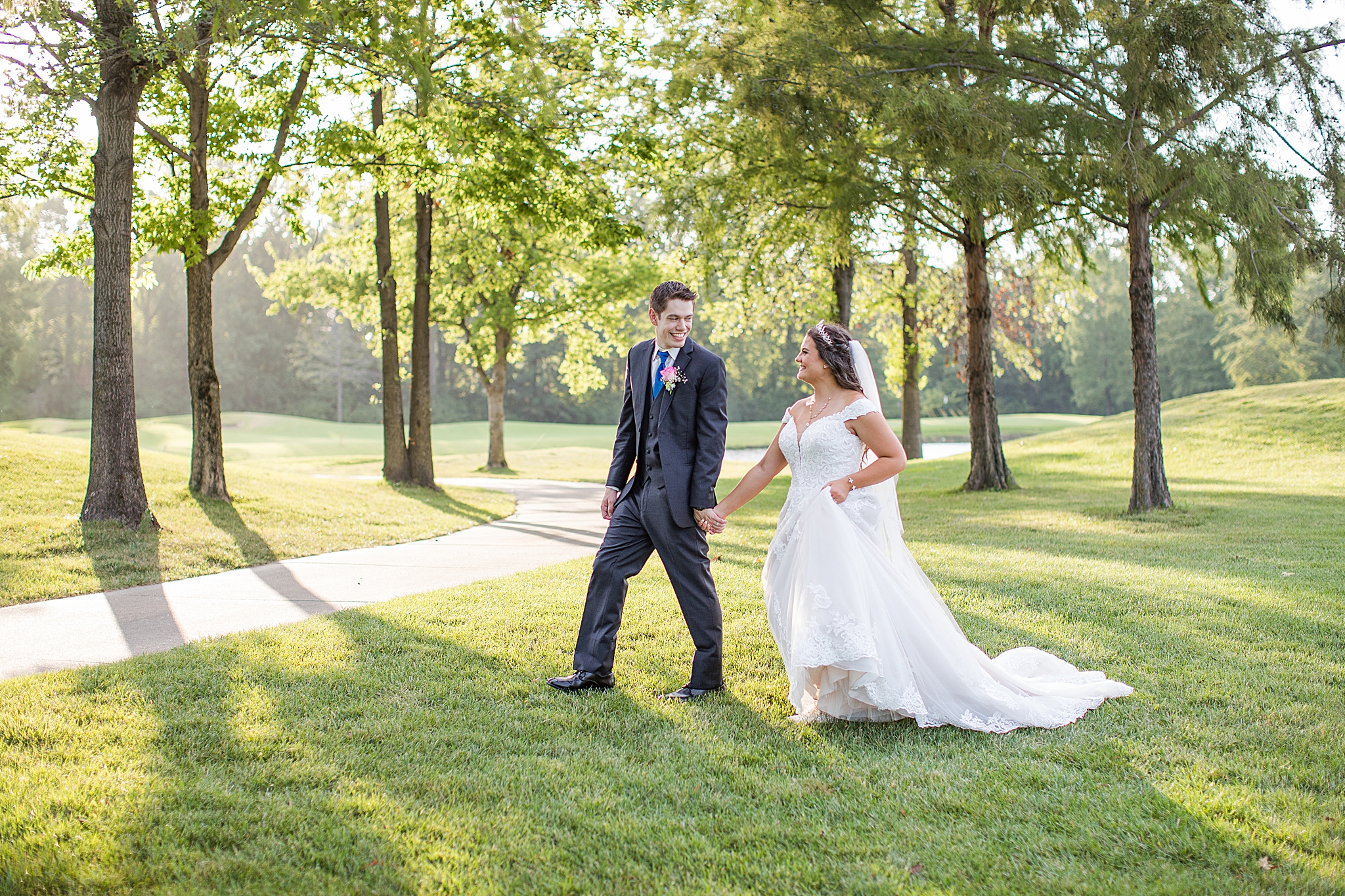 couple walks through field at Old Hickory Golf Club