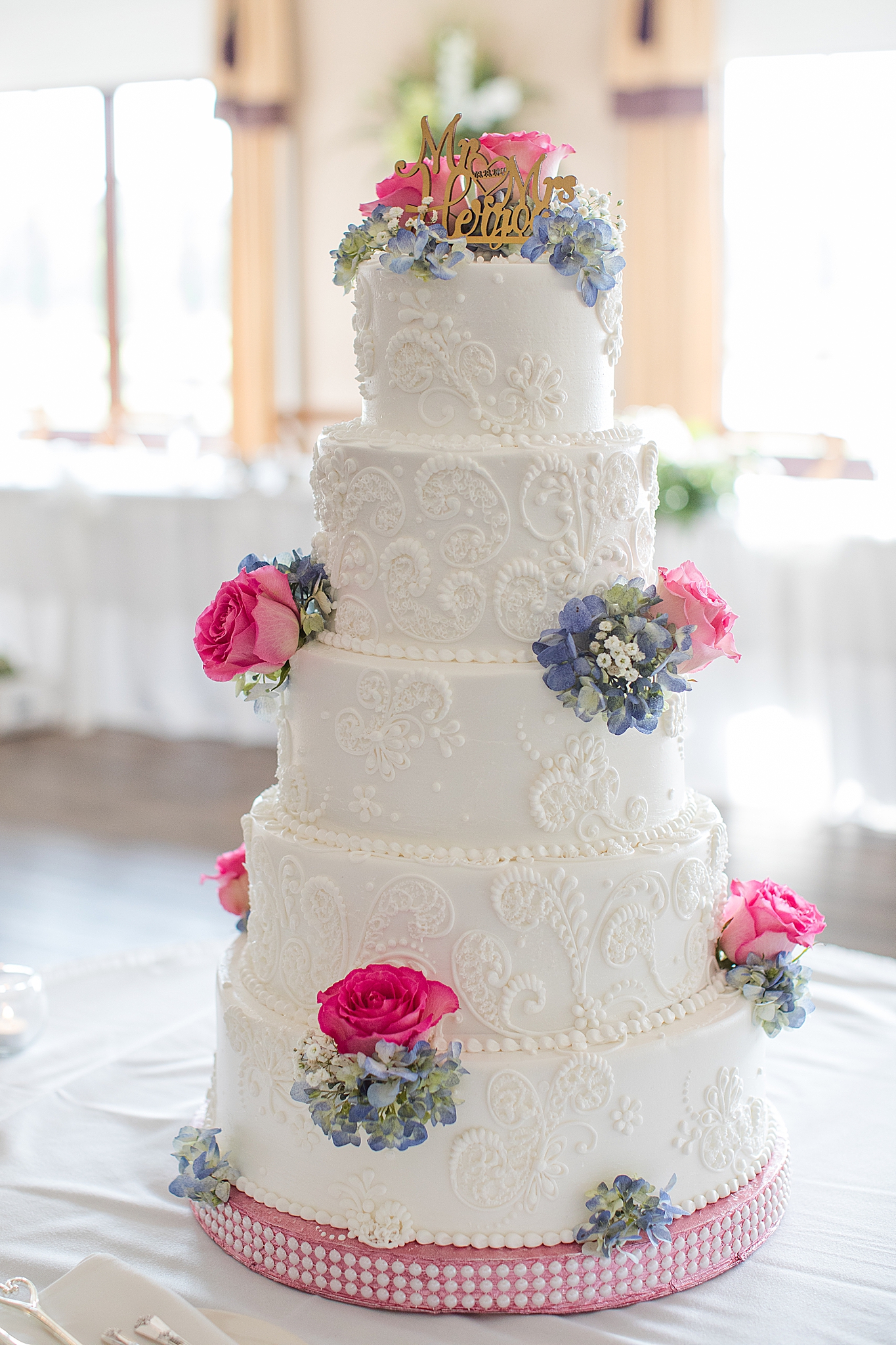 tiered wedding cake with floral accents