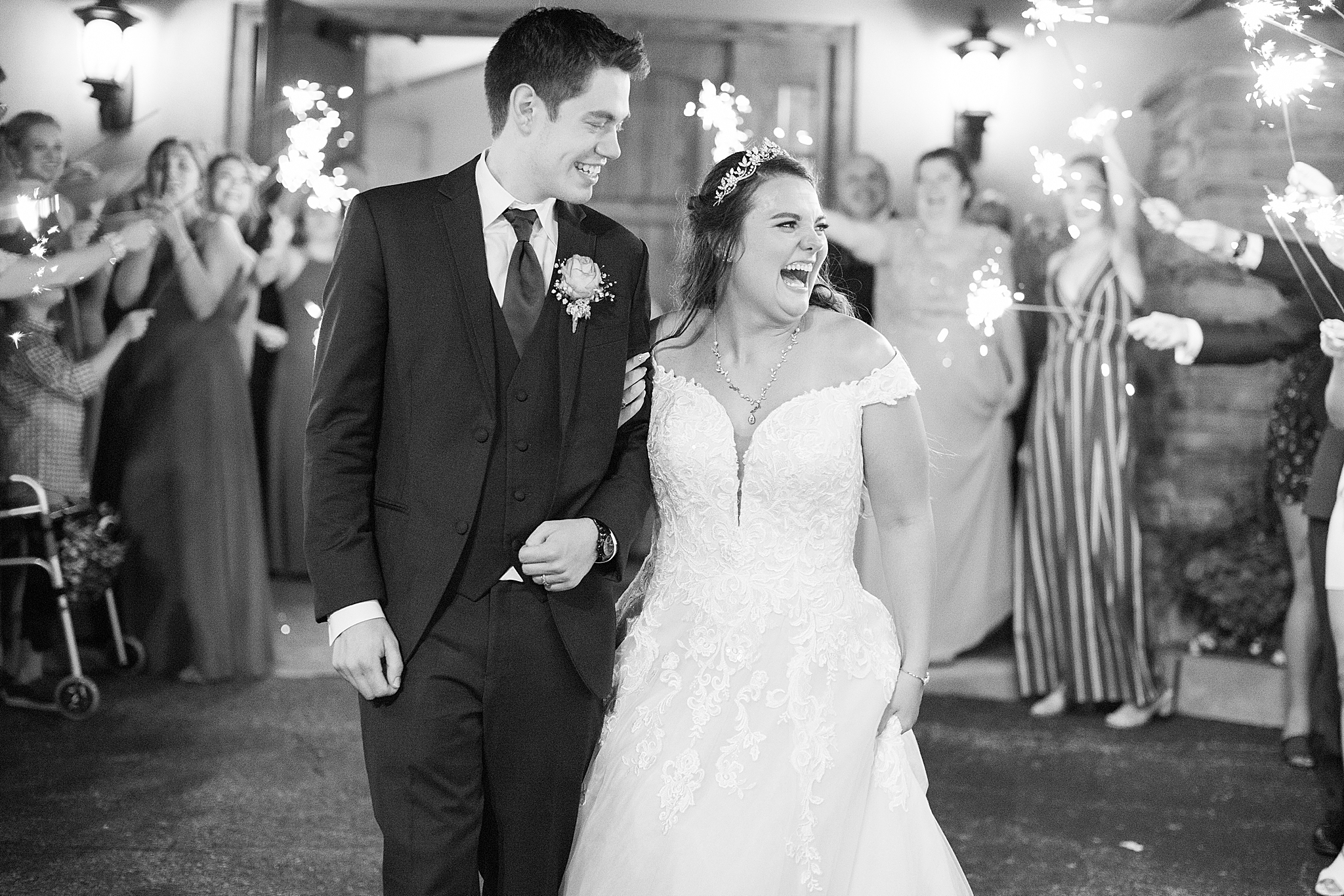 couple laughs during sparkler exit from Old Hickory Golf Club